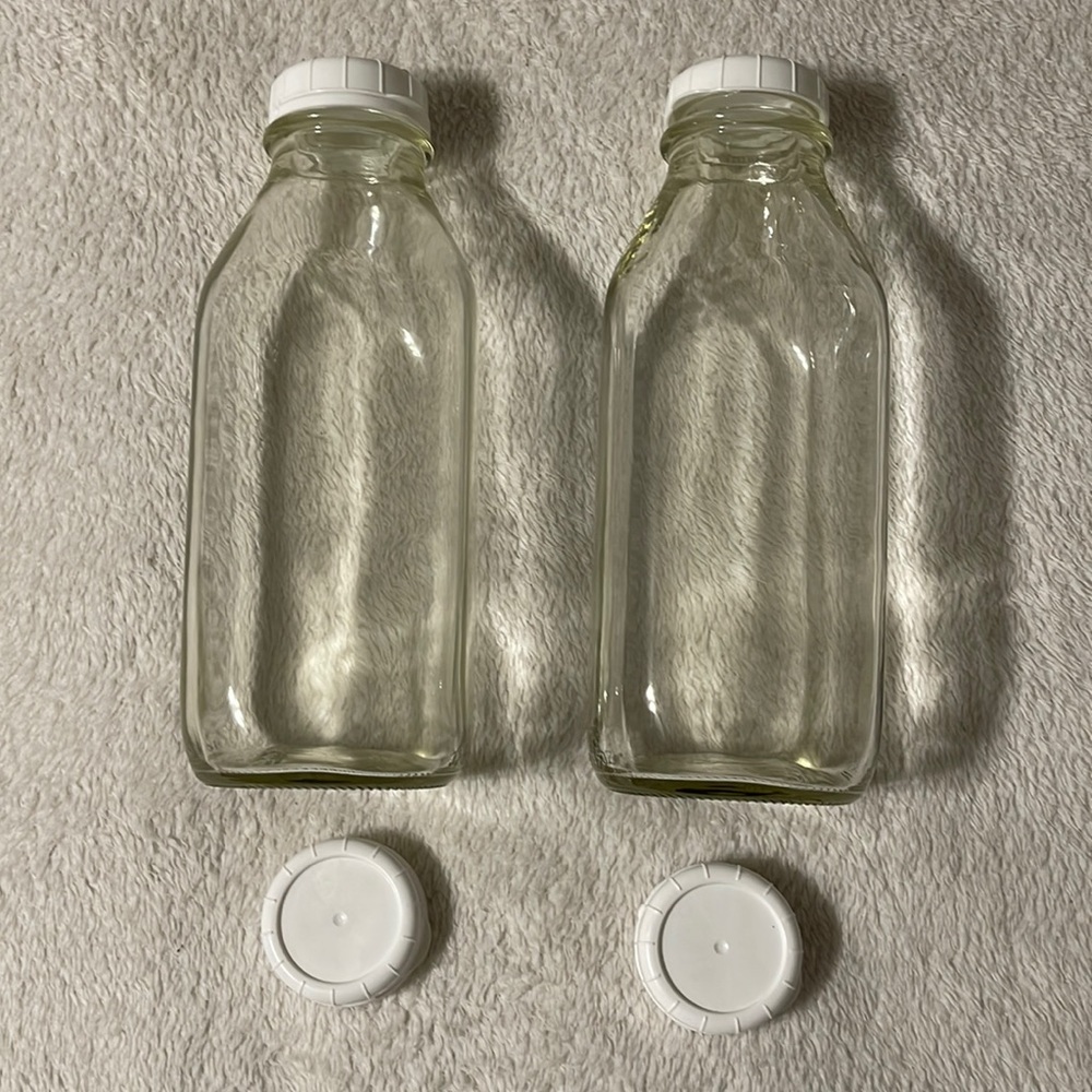 (2)The Dairy Shoppe Heavy Milk Glass bottles with 4 plastic caps